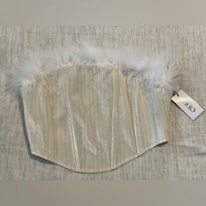 Cute silky tube top with a feather trim. Never worn- tags still on.